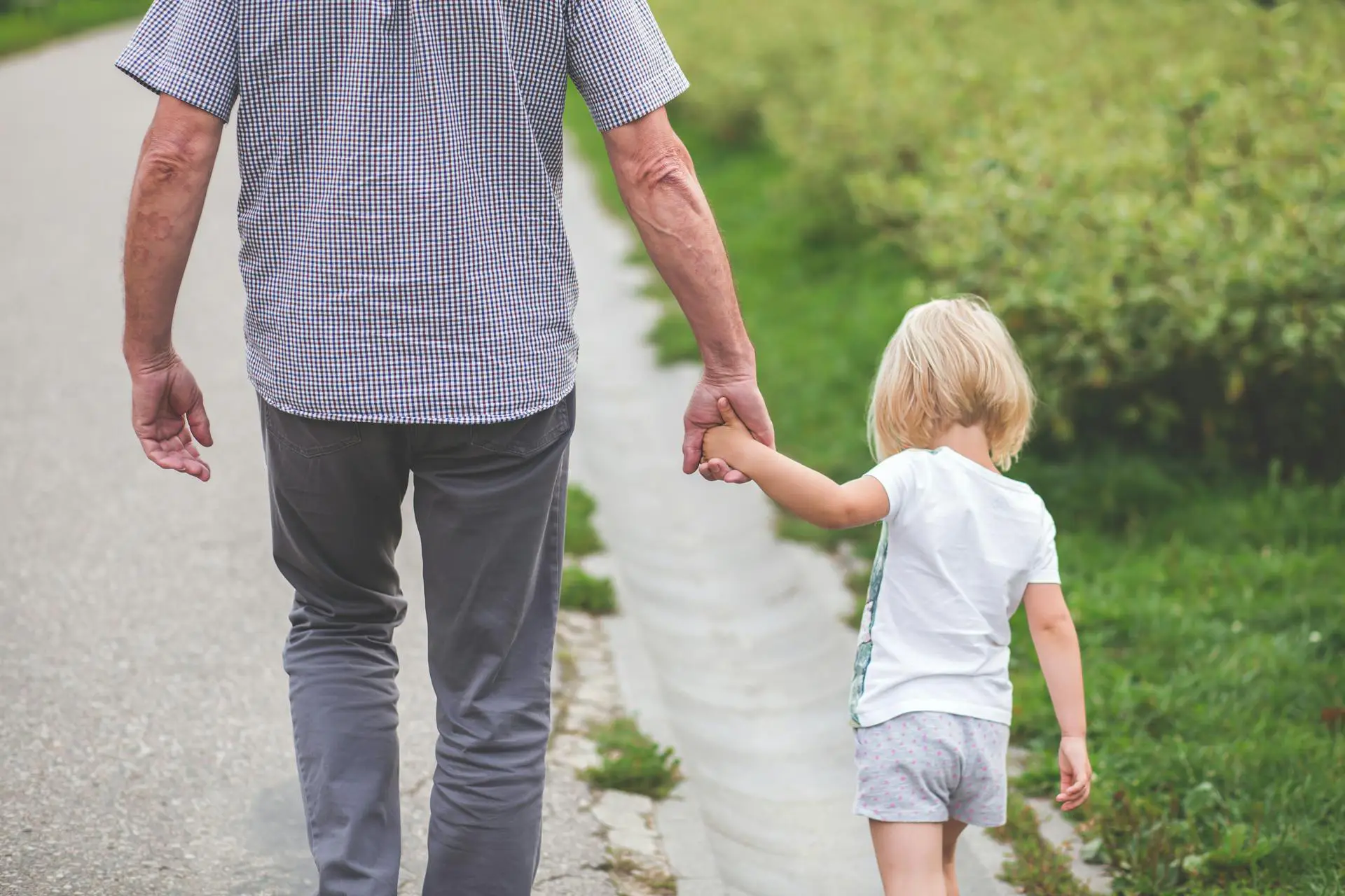 grand-father-walking-with-his-grandchild